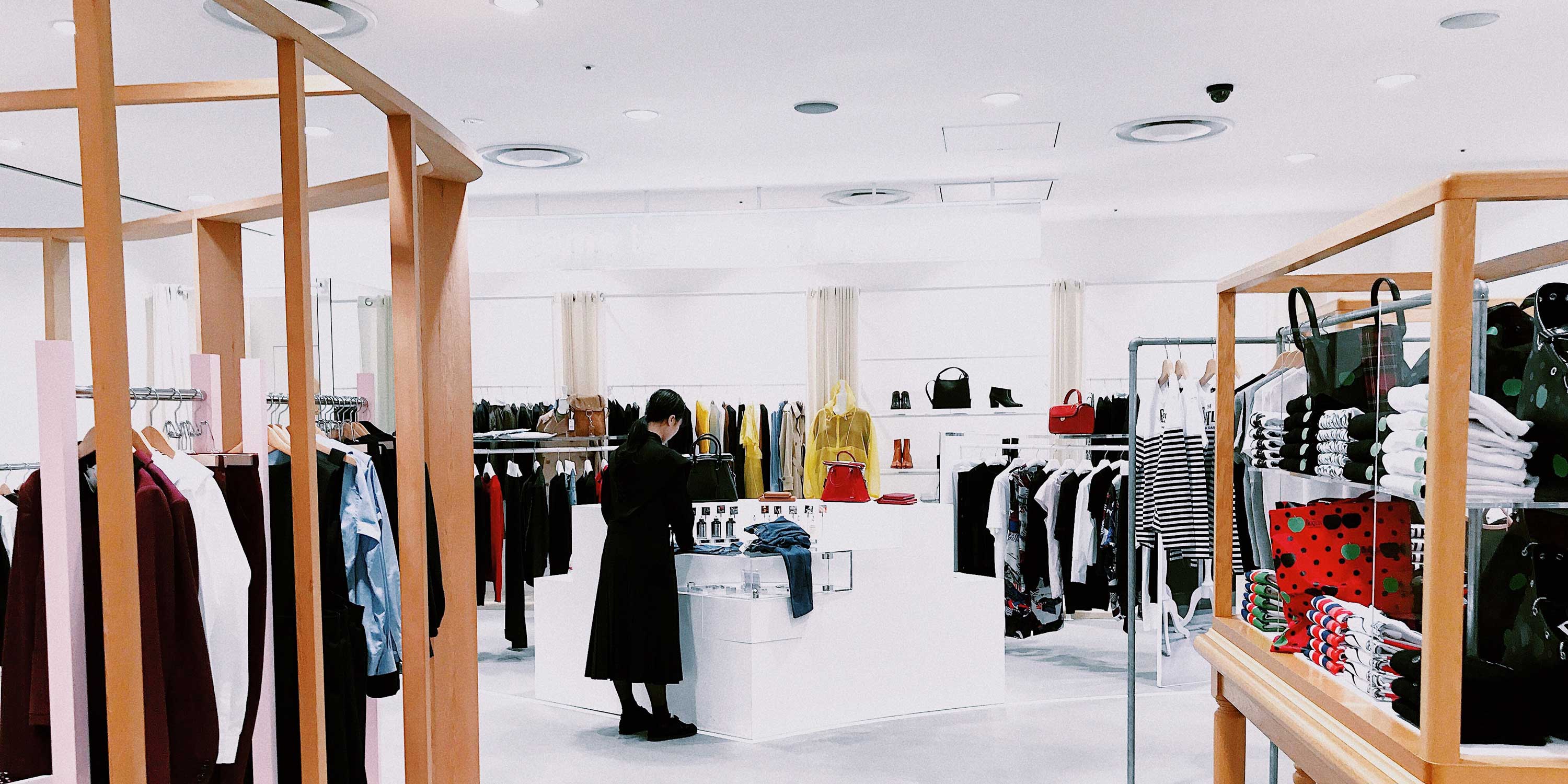bright white retail space selling clothing and accessories