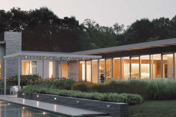 A nighttime garden scene showcasing trees illuminated by lights, offering a serene and enchanting environment.