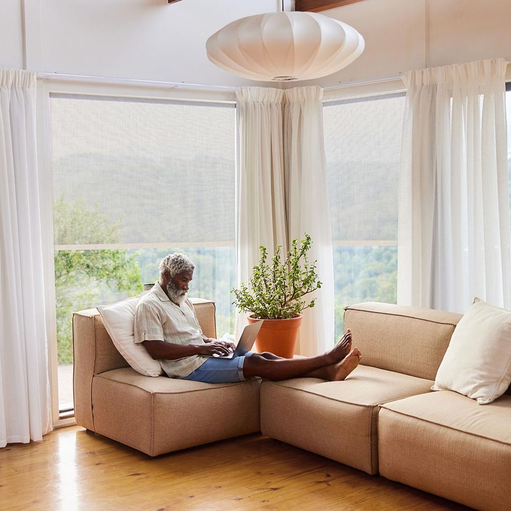 crestron drapery system in home with view of water